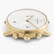 Side profile of the gold-tone case with the crown between two pushers.