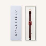Burgundy-dial watch in its gift box