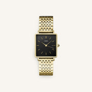 Gold-tone square watch with black dial, front view