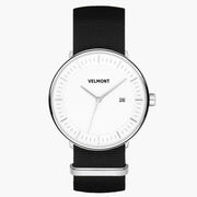 Watch with a white dial and silver-tone case on a black woven strap.