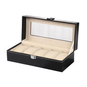 Open black watch box with five cream pillows and window lid