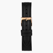Black strap with a rose gold-tone pin buckle, shown upright.
