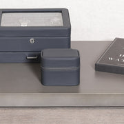 Closed two-watch travel case next to a watch box