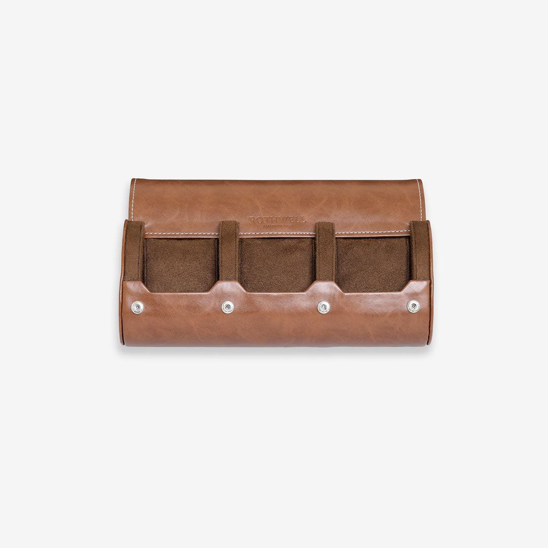 Open tan watch roll with three sections and brown lining