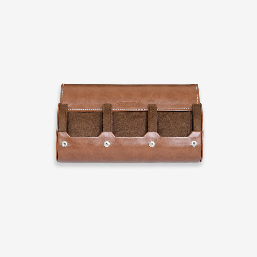 Open tan watch roll with three sections and brown lining