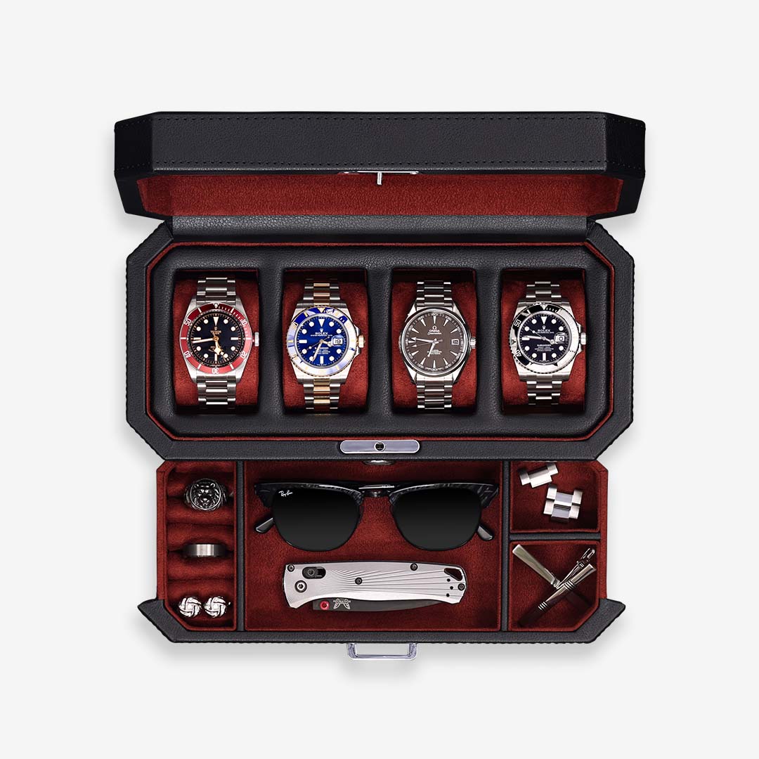 Four-slot watch box from above with red interior, watches and accessory drawer
