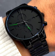 Green accent watch close up on the wrist
