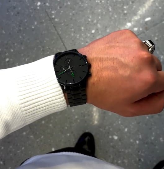 Black watch on a raised wrist