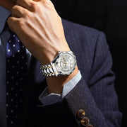 White dial watch worn with a suit