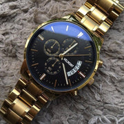 Gold-tone watch on soft fabric