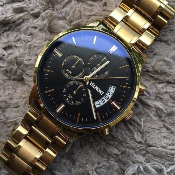 Gold-tone watch on soft fabric