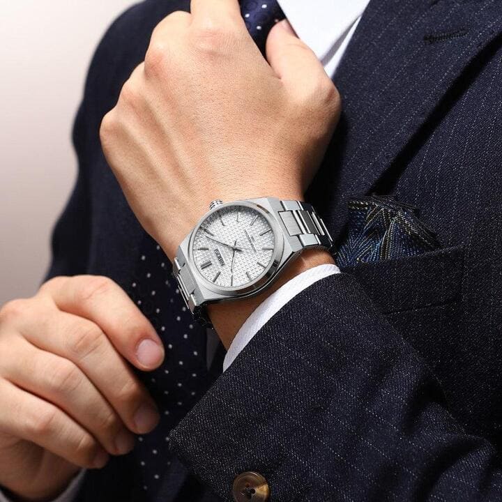 White dial watch worn with a suit