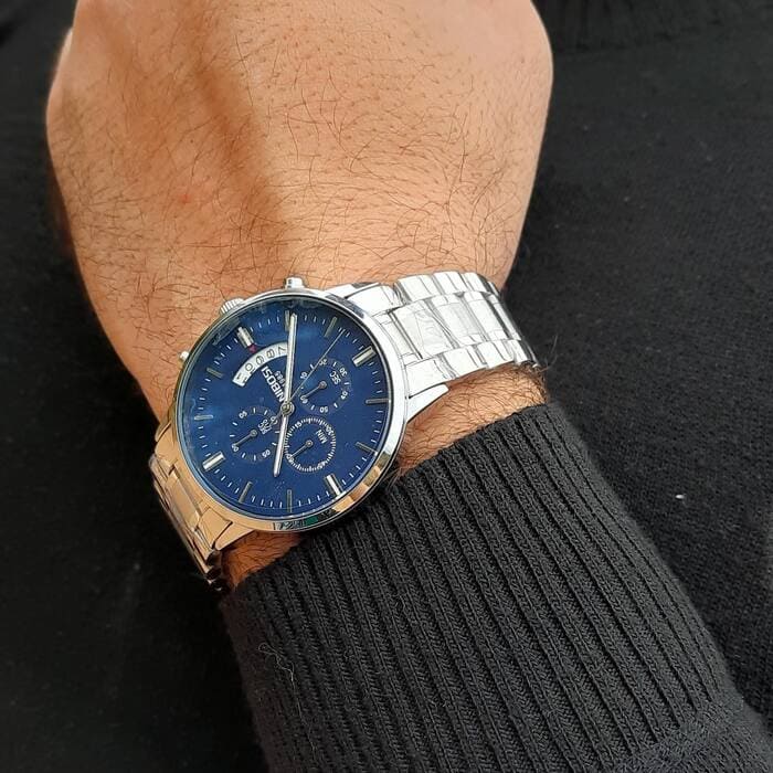 Blue dial watch on the wrist