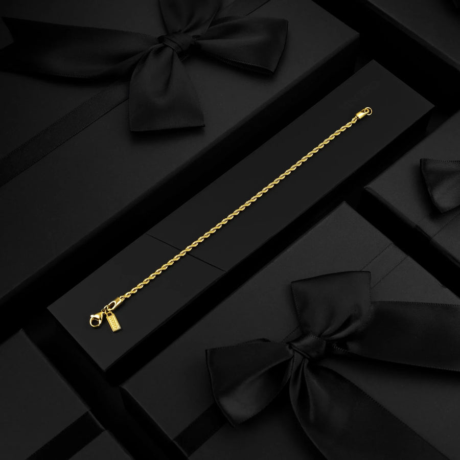 Gold-tone rope chain bracelet in a black gift box