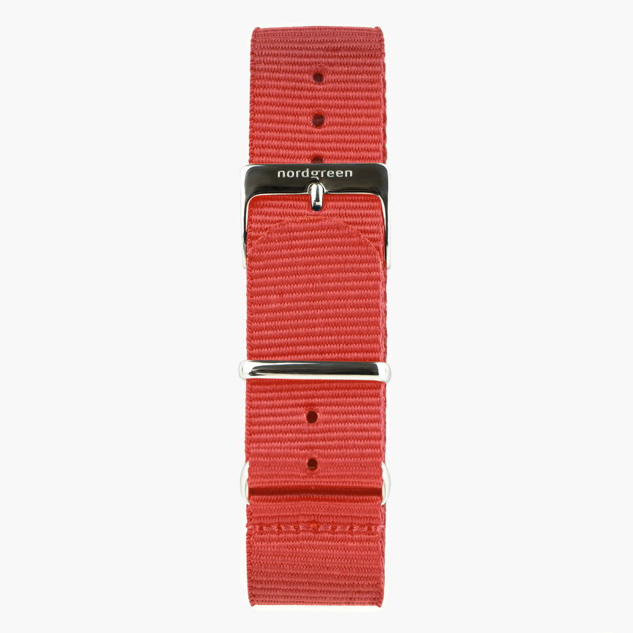 Red ribbed nylon strap with a polished silver-tone buckle and keeper rings.