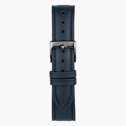 Navy smooth strap fitted with a dark gunmetal buckle and two keepers.