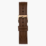 Dark brown strap with tonal stitching and a rose gold-tone pin buckle.
