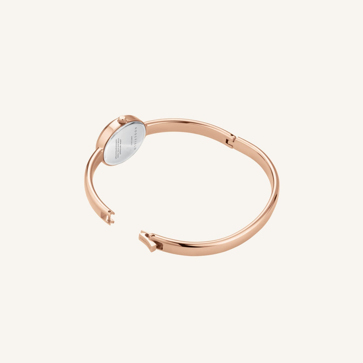 Rose gold-tone bangle seen from above, partly open