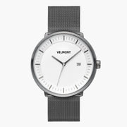 Front view of a gunmetal watch with a white dial on a gunmetal mesh strap.