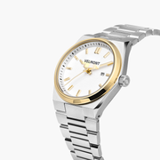 Angled view of the gold-tone bezel, date window and silver-tone crown.