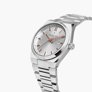 Angled view showing the flat bezel, date window and silver-tone crown.