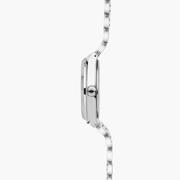Slim side profile of the case with the crown and bracelet.