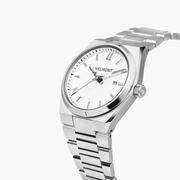 Angled view of the white dial and the faceted silver-tone case shoulders.