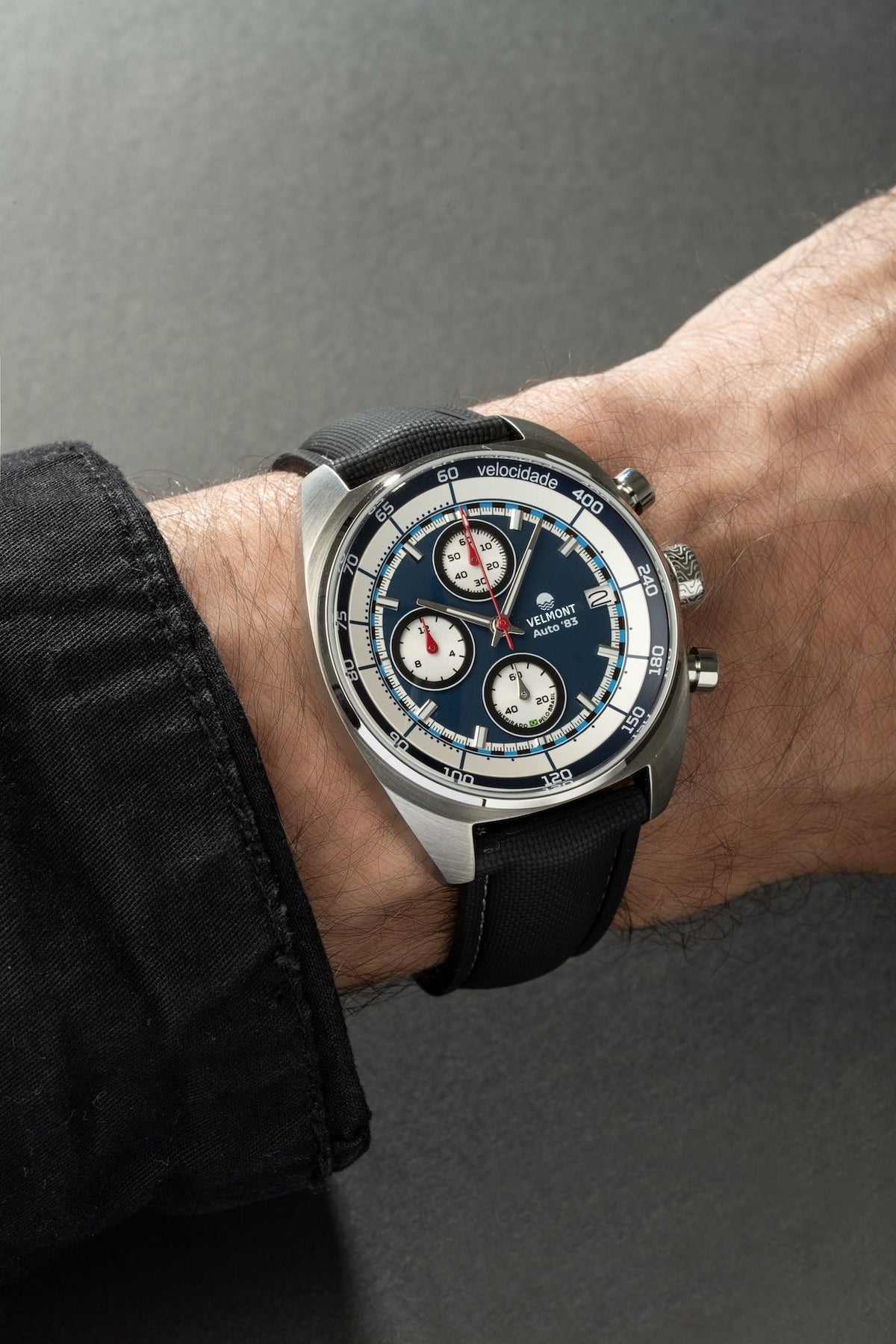 Blue chronograph on the wrist with a black strap
