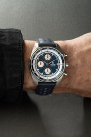 Blue chronograph on the wrist with a blue strap