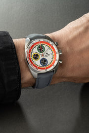 White chronograph on the wrist with a gray strap