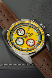 Yellow chronograph on brown strap at an angle