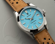 Turquoise watch on tan strap at an angle