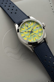 Wave dial watch on a blue strap at an angle