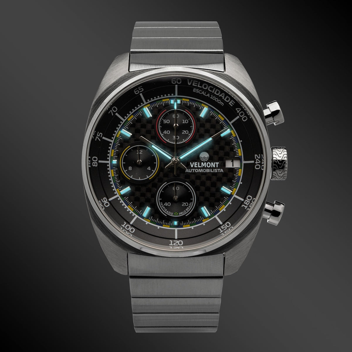 Carbon chronograph glowing on a dark background