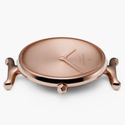 Side view of the rounded case with curved lugs and a faceted crown.