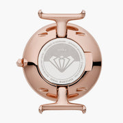Polished rose gold-tone case back with an engraved center medallion.