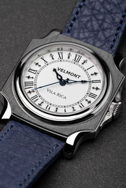 Close-up of the Roman numeral dial and blue hands
