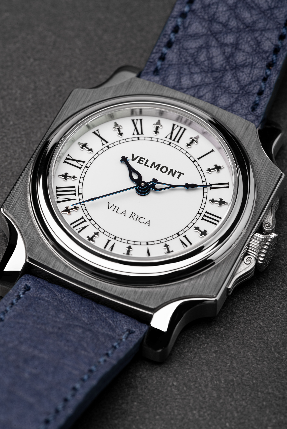 Close-up of the Roman numeral dial and blue hands