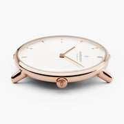 Side view of the slim rose gold-tone case with wire lugs and crown.