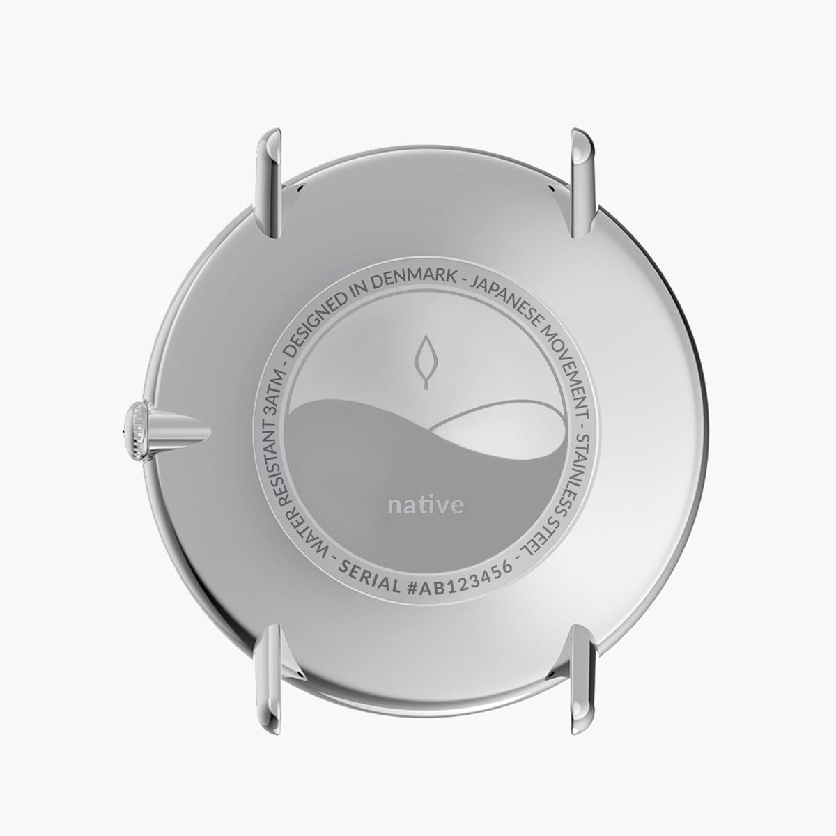 Silver-tone case back with engraved center disc, strap removed.