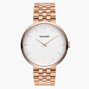 Minimalist watch with a white dial and rose gold-tone case on a matching link bracelet.