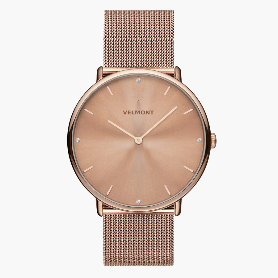 A rose gold-tone sunburst dial framed by a slim rose gold-tone case, set on a rose gold-tone mesh strap.