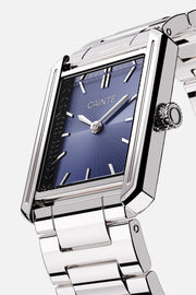 Angled view of the rectangular case and blue sunburst dial
