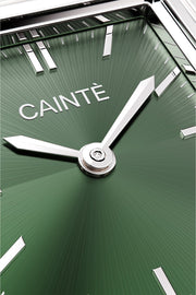 Close-up of the olive green sunburst dial and polished hands