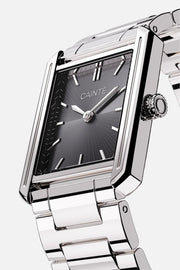 Angled view of the rectangular case and black sunburst dial