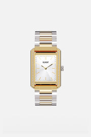 Front view of the gold-tone rectangular watch on a two-tone bracelet