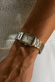 Close-up of the rectangular watch on the wrist