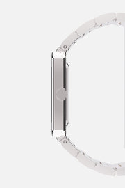 Side profile showing the slim case and fluted crown