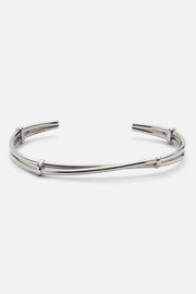 Silver-tone open twisted cuff bracelet, front view on a light background