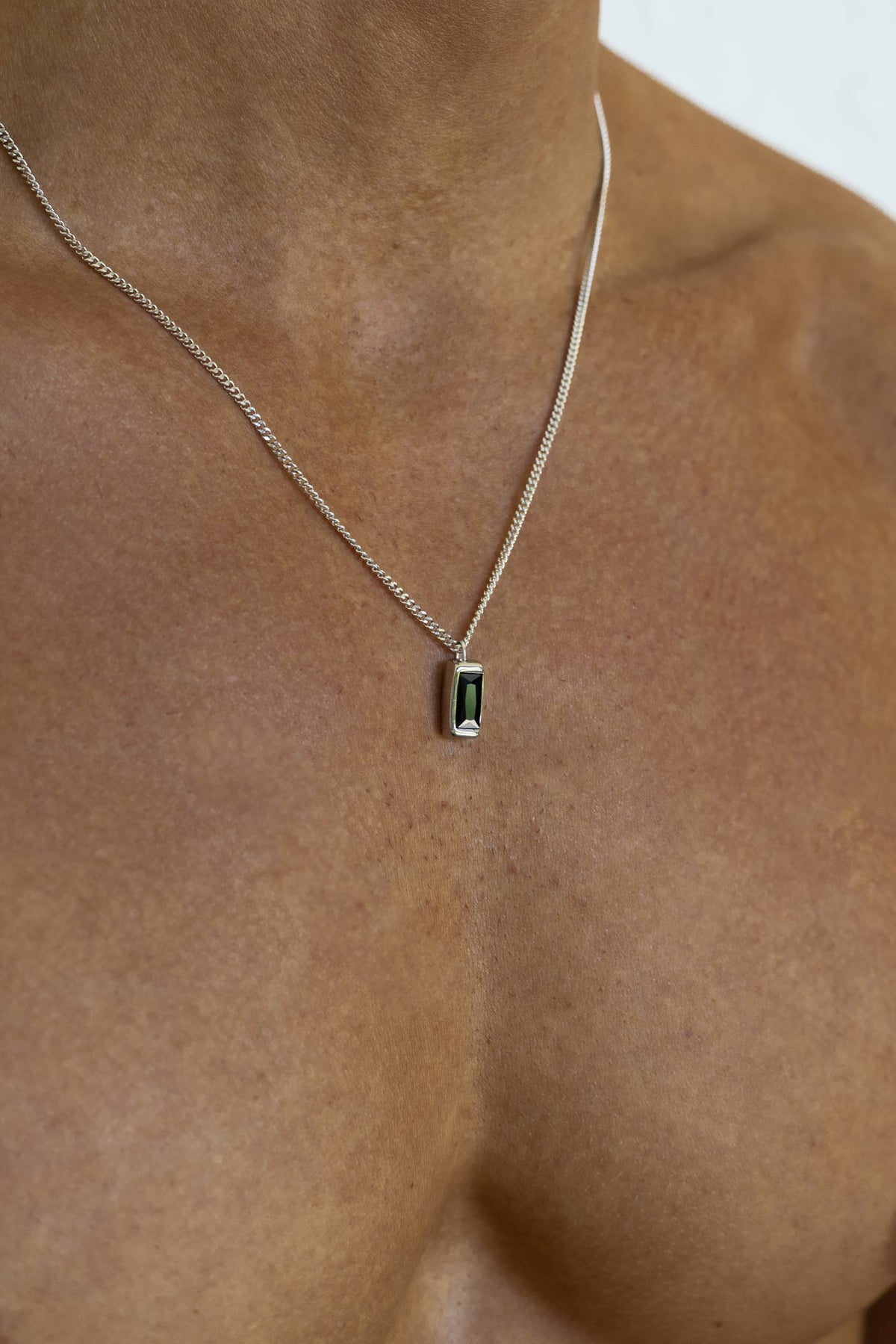 Silver-tone necklace with a rectangular green stone pendant, view 2 of 5